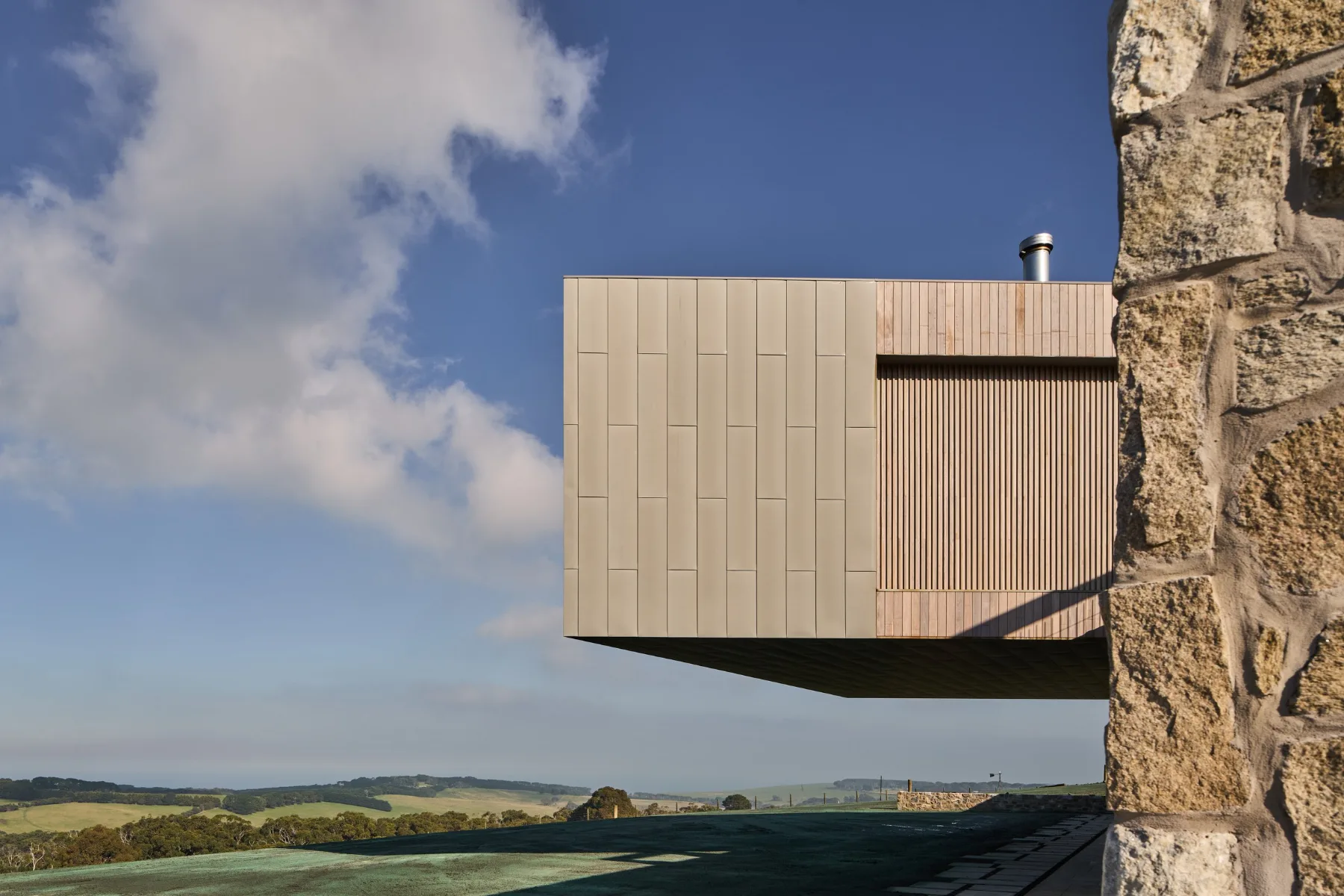 Conargo Estate, Flinders. Cantilevered form against the stone wall.
