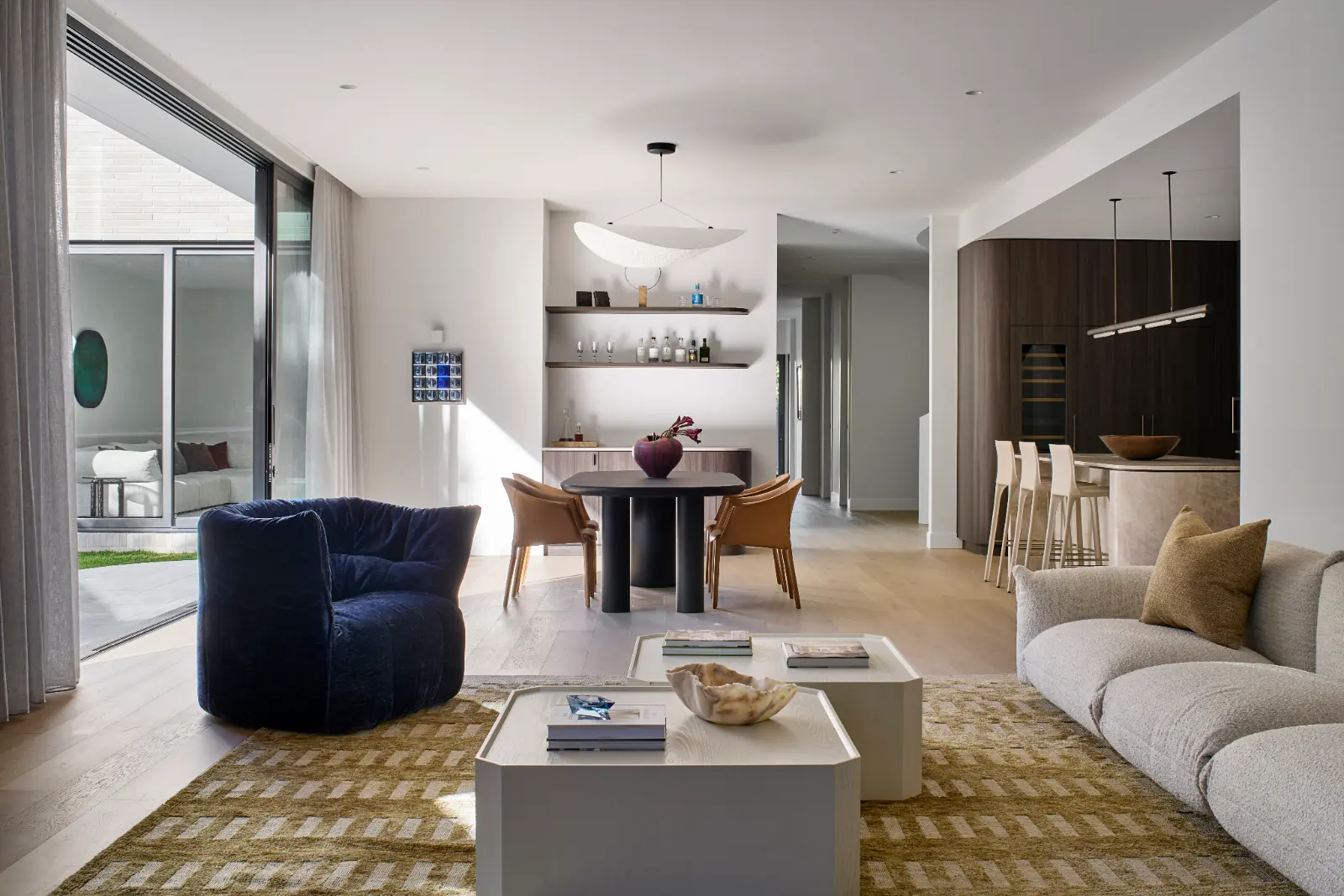 Madden Grove, Kew. Living and dining opening to the courtyard.