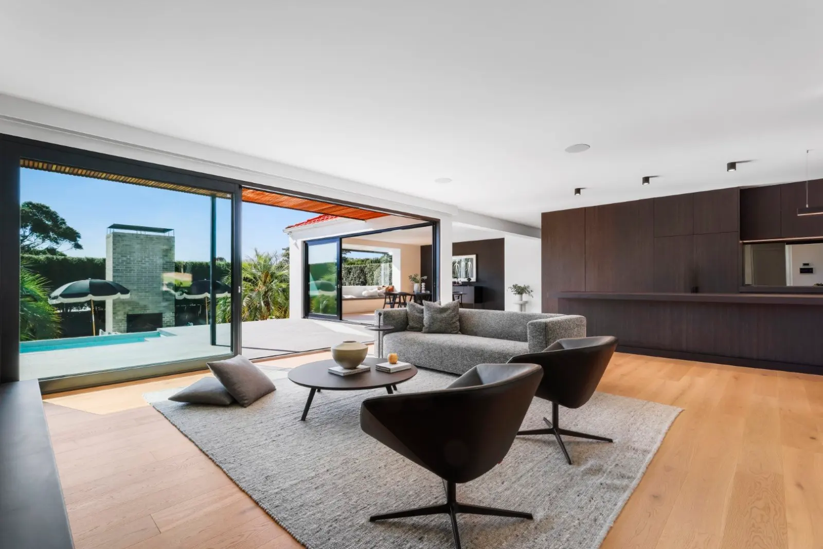 Malabar. Living room opening to the pool.